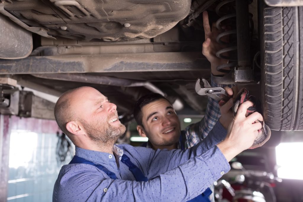 mechanic performing auto repair in tucson az