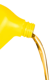 car oil being poured out of yellow container