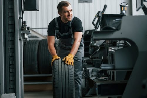 Tucson mechanic working on tire balancing